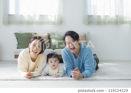 A family relaxing in the living room 119124229