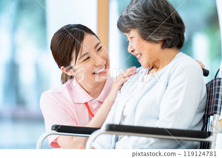 Senior woman talking to caregiver Female caregiver talking to grandmother Senior woman talking to caregiver Female caregiver talking to grandmother 119124781