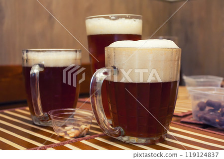 Glasses of dark beer in a pub Glasses of dark beer in a pub 119124837