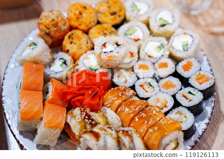 A large plate with an assortment of rolls. A large plate with an assortment of rolls. 119126113