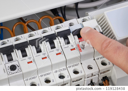 Hand Switching Off Circuit Breaker for Maintenance 119128438