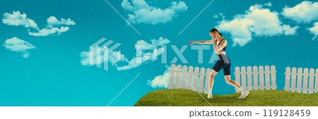 Young focused woman boxing with dumbbells in hands, training with blue sky and clouds above. Creative art collage. 119128459