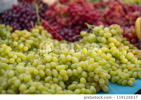 grapes displayed on a farmer's market counter grapes displayed on a farmer's market counter 119128837