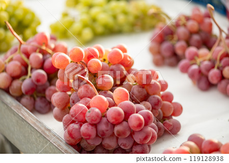 grapes displayed on a farmer's market counter grapes displayed on a farmer's market counter 119128938