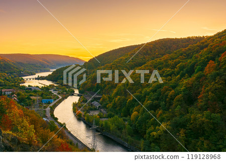 mountain river at dusk. landscape of romania in autumn. somes river in apuseni mountains in fall season. beautiful scenery of european countryside mountain river at dusk. landscape of romania in autumn. somes river in apuseni mountains in fall season. beautiful scenery of european countryside 119128968