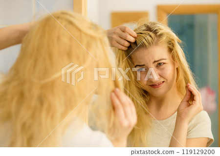 Female having problem with blonde hair 119129200