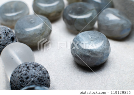Close-up of beads for bracelet on gray background. Beautiful beads of blue and light blue colors 119129835