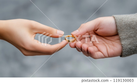 Hands Exchanging a Gold Ring Symbolizing Commitment and Connection, AI 119130003