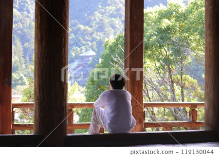 A young man looking out the window at Toyokuni Shrine A young man looking out the window at Toyokuni Shrine 119130044