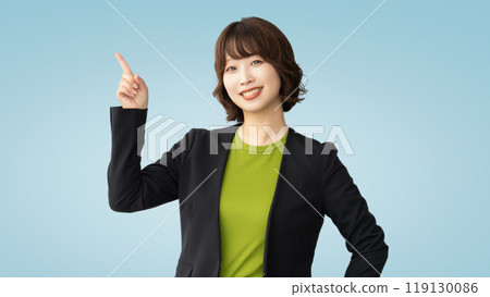 A businesswoman pointing with her index finger up A businesswoman pointing with her index finger up 119130086