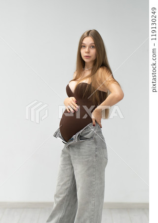 female tummy motherhood background happy jeans positive maternity expectant girl pregnancy mother 119130249