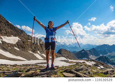Sporty woman hiking in Switzerland alps. Heathy lifestyle, sport, beauty in nature. Grindelwald valley, Swizz 119130529