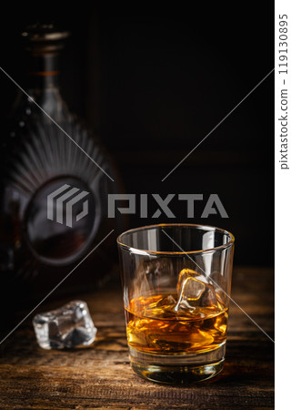 Whiskey with ice in glasses Whiskey with ice in glasses 119130895