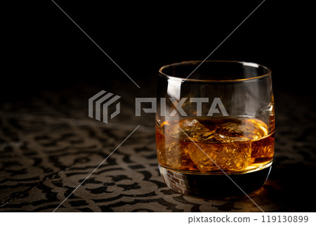 Whiskey with ice in glasses 119130899