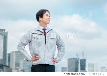 Engineer standing in work clothes 119131412