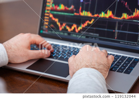 Close-up of male hands using laptop and typing on keyboard. Modern remote work and business. Online trading Close-up of male hands using laptop and typing on keyboard. Modern remote work and business. Online trading 119132044