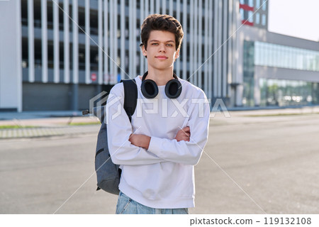 Portrait of college student guy looking at camera outdoor, urban style Portrait of college student guy looking at camera outdoor, urban style 119132108