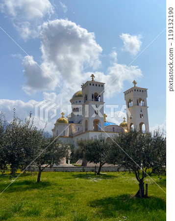 The Cathedral Church of Serbian Saint Jovan Vladimir is one of largest religious Orthodox buildings in Montenegro. Majestic snow-white temple with gilded domes and bells 119132190