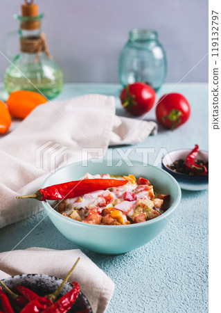 Spicy creamy mexican salsa in a bowl on the table vertical view 119132797