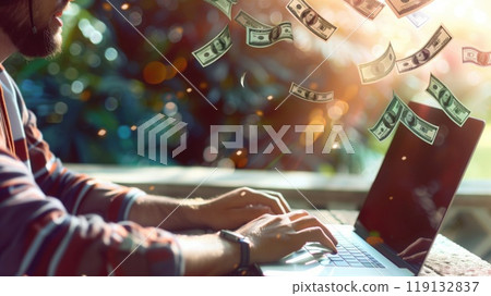 A large plan of a person's hands near an open laptop with money pouring out. The concept of freelancing and quick money 119132837