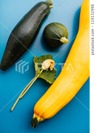 Yellow and green zucchinis, round green zucchini on the wood background. Yellow and green zucchinis, round green zucchini on the wood background. 119132998