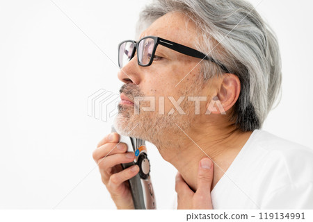 A man shaving his beard A man shaving his beard 119134991