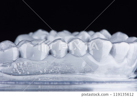 Transparent plastic night mouth guard for teeth clenching. Remedy for grinding teeth, oral care. Transparent plastic night mouth guard for teeth clenching. Remedy for grinding teeth, oral care. 119135612