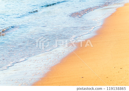 Soft wave of the sea on the sandy beach. 119138865