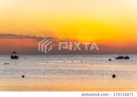 Beautiful yellow and orange sunrise over the sea. 119138871