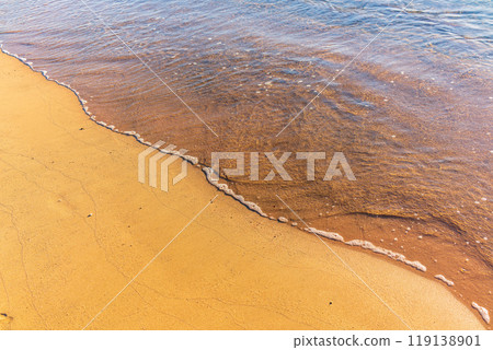 Soft wave of the sea on the sandy beach. Soft wave of the sea on the sandy beach. 119138901