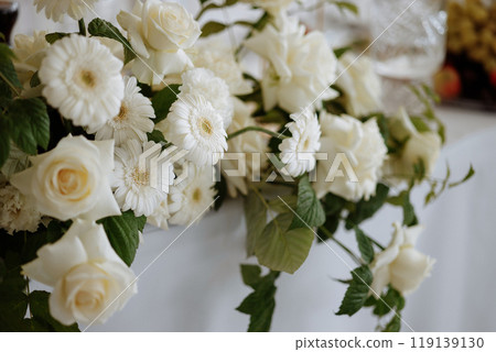 A bouquet of white roses and daisies 119139130