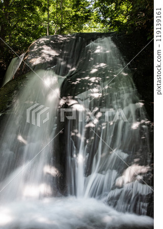 A beautiful waterfall with clear water A beautiful waterfall with clear water 119139161