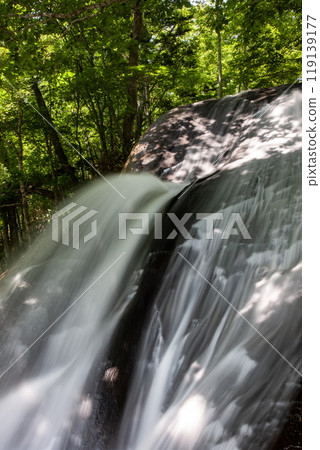 A beautiful waterfall with clear water A beautiful waterfall with clear water 119139177