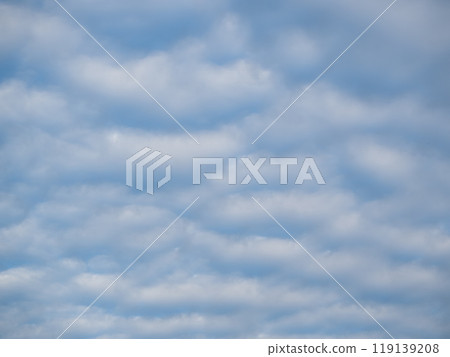 Beautiful blue sky with unusual white Altocumulus undulatus clouds 119139208