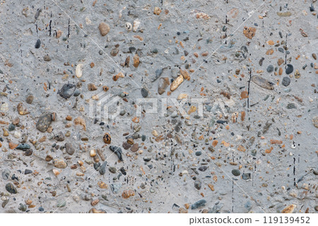 Texture of concrete surface with multicolored pebbles Texture of concrete surface with multicolored pebbles 119139452
