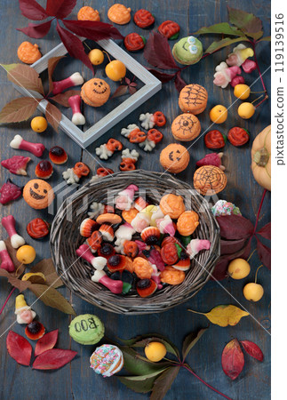 Wooden Halloween candy board. Holidays and Food. Dessert in shape of pumpkin, skull, witch. Wooden Halloween candy board. Holidays and Food. Dessert in shape of pumpkin, skull, witch. 119139516