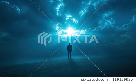 Solitary Figure Stands Amidst Moody Blue Sky and Clouds Evoking Contemplation and Solitude 119139959