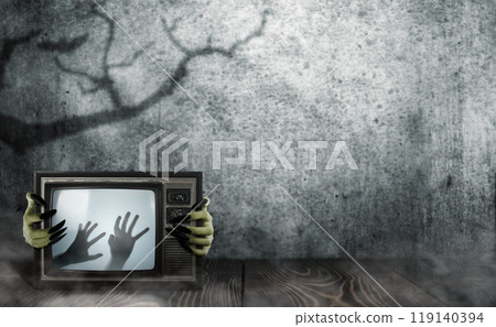 Witch hand with long black nail holding television with shade of zombie hands on screen. The hand appearing to be devil, evil, satan, or monster hands Witch hand with long black nail holding television with shade of zombie hands on screen. The hand appearing to be devil, evil, satan, or monster hands 119140394