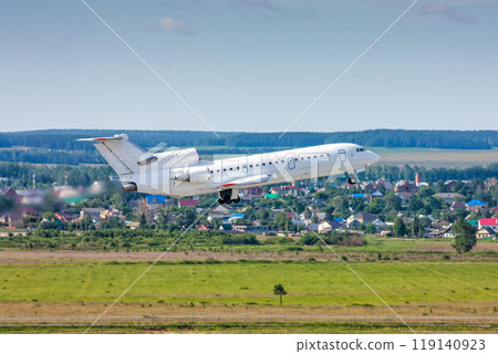 Passenger aircraft taking off in a blue sky 119140923