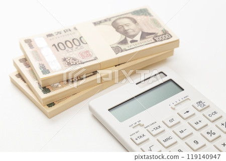 A stack of 10,000 yen bills and a calculator on a white background A stack of 10,000 yen bills and a calculator on a white background 119140947