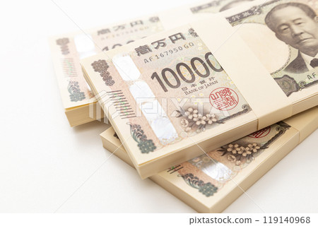 A stack of 10,000 yen bills on a white background 119140968
