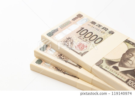 A stack of 10,000 yen bills on a white background A stack of 10,000 yen bills on a white background 119140974