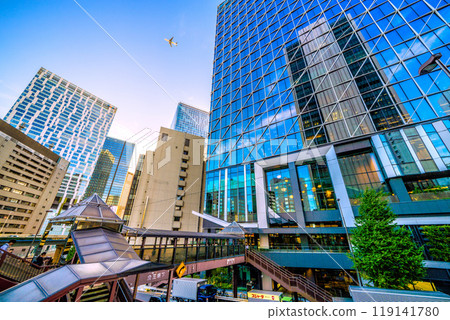 Tokyo cityscape in Japan: airplanes...a city with a pedestrian bridge. Overlooking Shibuya Aqs. The left background is the direction of Shibuya Station = October 7th 119141780