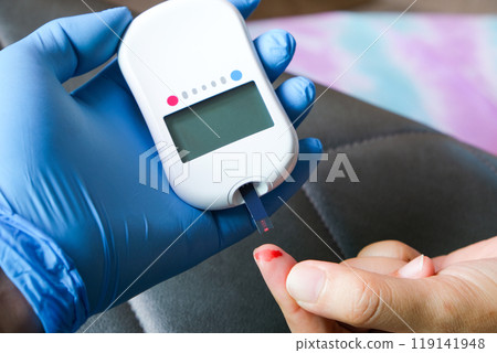 hand of people check diabetes and high blood glucose monitor with digital pressure gauge. Healthcare and Medical concept 119141948