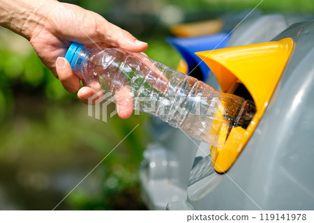 Please dispose of plastic bottle into the tank. A man throw rubbish in the trash can by separate garbage to dispose like hazardous waste , Please dispose of plastic bottle into the tank. A man throw rubbish in the trash can by separate garbage to dispose like hazardous waste , 119141978