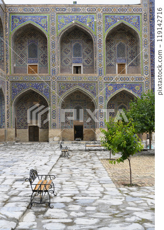 Courtyard of the Ulugbek Madrasah of 14 century in Samarkand, Uzbekistan with decorated portal 119142716