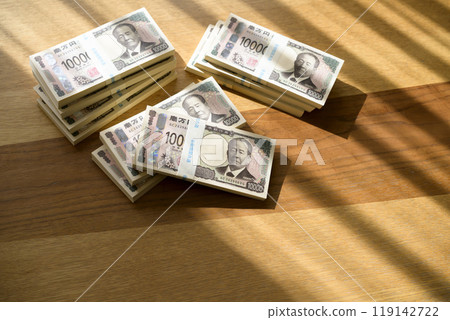 A stack of bills on a table (new bill version) 119142722