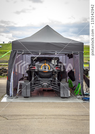 Buggy under the tent 119142942