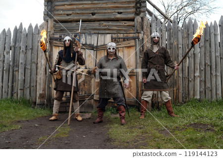 Reenacting Medieval Knights with Flaming Torches Outside Fort Reenacting Medieval Knights with Flaming Torches Outside Fort 119144123