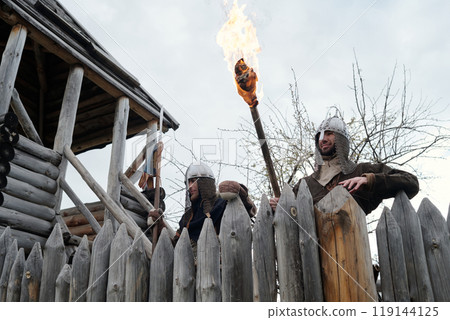 Guarding Fort with Flaming Torch and Wooden Fence Guarding Fort with Flaming Torch and Wooden Fence 119144125
